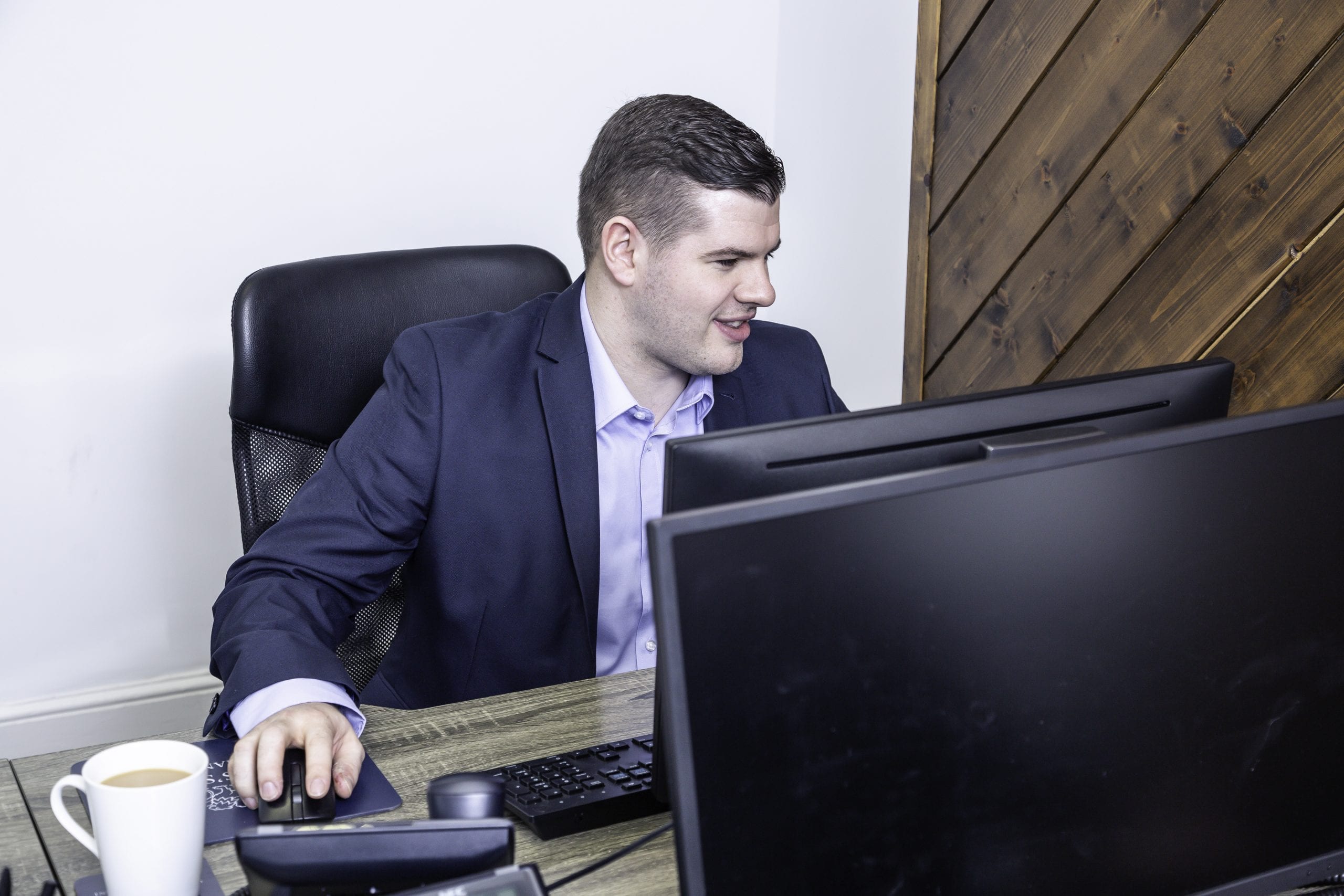 Man working at the front of the computer